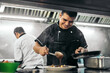 © Pedro Merino/Stocksy - Latin chef preparing nachos