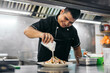 © Pedro Merino/Stocksy - Latin chef cooking nachos
