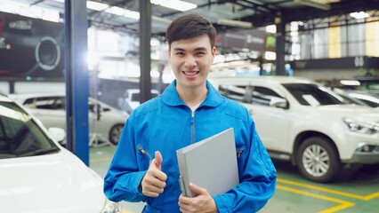 Wall Mural - Portrait of Asian handsome automotive mechanic men standing in garage.