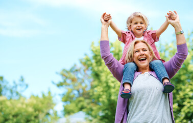 When grandparents enter discipline leaves. Portrait of a happy grandmother holding her grandchild on her shoulders.