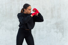 Determined Sportswoman Fighting During Training