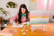 © ByLorena/Stocksy - Pretty bussineswoman working in cute workplace