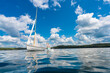 © JP Danko/Stocksy - Diving off Dinghy Sailboat Anchored on Northern Cottage Lake