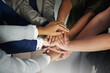 © Arnéll Koegelenberg/peopleimages.com - Committed to doing it together. Closeup shot of a group of unrecognisable businesspeople joining their hands together in unity.