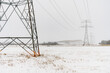 © unite images/Stocksy - Electricity pylons in winter freezing weather