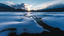 Frozen River Covered Snow In Sunset