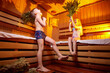 A girl and a boy in a Russian bath. Bathhouse in Russia for a family with a brother and sister. The concept of a healthy baby in the steam room