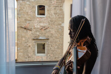 Black Girl On Violin By A Window