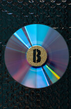 Bitcoin Emblem On A Compact Disk