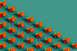 © Giada Canu/Stocksy - Orange megaphones on green. 3d render