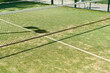 © Ivan Gener/Stocksy - Padel court net outside in summer