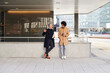 © Ivan Gener/Stocksy - Businessmen talking outside during their lunch break