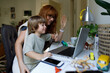 © Tanya Yatsenko/Stocksy - Mom and son talking online at home