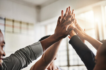 Poster - Time to bring our best. Shot of a group of young people giving each other a high five during their workout in a gym.