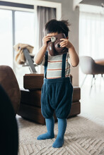 Asian Little Baby Boy Using A Camera