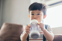 Asian Little Baby Boy Drinking Milk