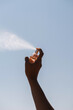 © Lucas Ottone/Stocksy - Spraying perfume