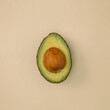 © Copal Studio/Stocksy - Sliced Avocado on tan backdrop
