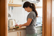 © Hernandez & Sorokina/Stocksy - Woman Doing Food At Home