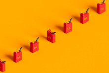 A Row Of Red Oil Tank On Orange Background