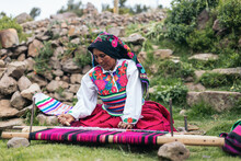 Peruvian Woman Weaving Using A Loom