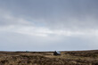 © Dave Wall/Stocksy - Two huts on a wild moorland