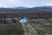 An Abandoned Caravan Left On Bleak Countryside