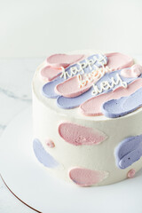 Canvas Print - Bento cake with blue and pink cream cheese frosting and Happy birthday text on top. Birthday cake on white background. Asian small cake trend.