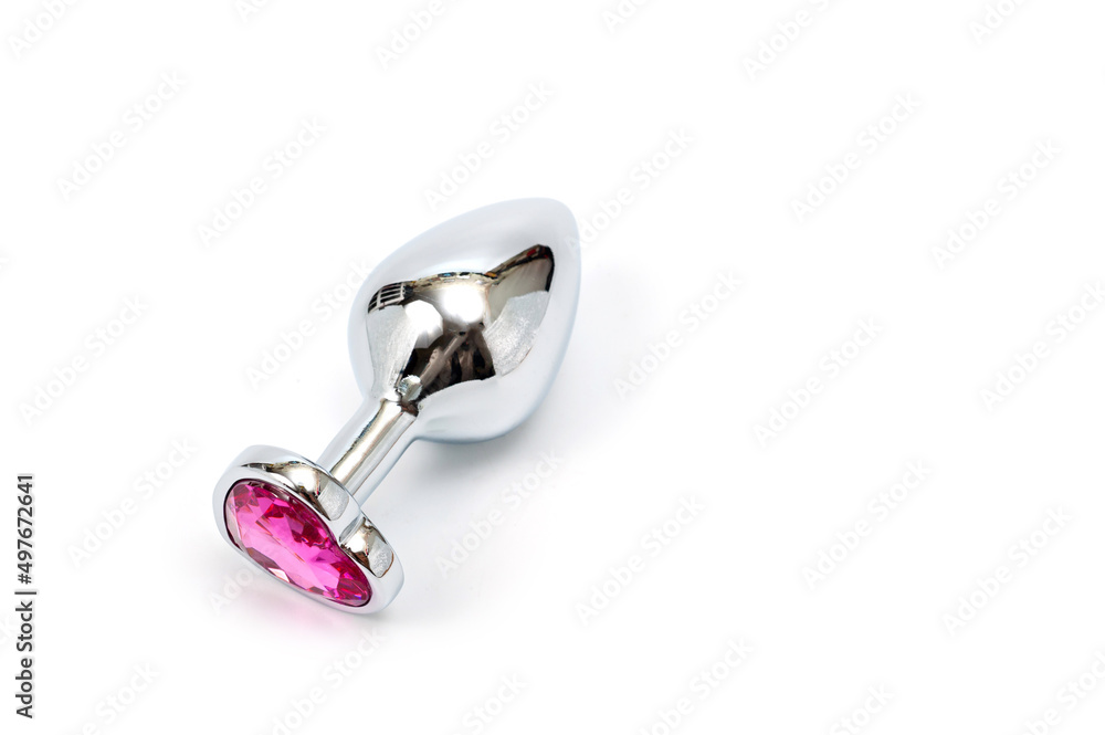 Metal butt plug with a decorative pink heart-shaped stone at the end. Stock  Photo | Adobe Stock