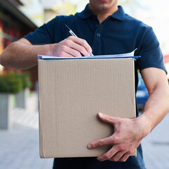 Canvas Print - Your package is safely on its way. Cropped shot of a courier holding a box for delivery.