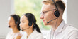 © Acronym - Team of professional support staff working in the office. Colleagues in the workplace solve customer problems. Call center and customer support concept.
