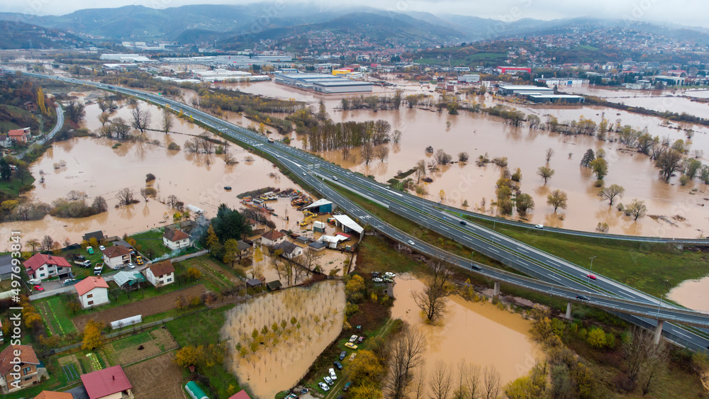 Aerial drone view of torrential rain causes flash floods in residential ...
