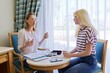 © Valerii Honcharuk - Female professional psychologist therapist talking to a teenage girl in office
