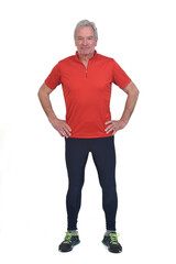 Wall Mural - front view of a senior man with sportswear hands on hip on white background