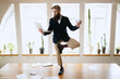 © master1305 - Young bearded man, office clerk having fun, doing yoga on wooden table in modern office at work time with gadgets. Concept of business, healthy lifestyle, sport, hobby