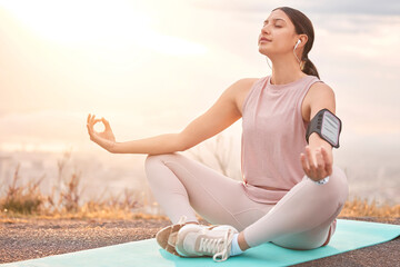 Canvas Print - Find your balance in life. Shot of a young woman meditating in nature.