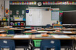 © Robert Peak - Wide angle view of empty elementary school classroom in the US.