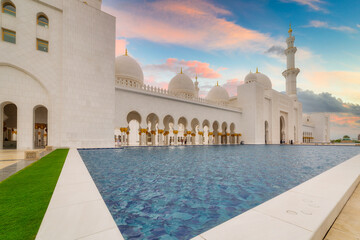 Wall Mural - Beautiful architecture of the Grand Mosque in Abu Dhabi at sunset, United Arab Emirates