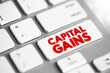 Capital gains - increase in a capital asset's value and is realized when the asset is sold, text button on keyboard