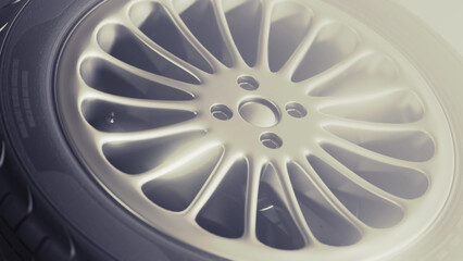 Wall Mural - Car rim tire wheel. Depicted perspective on a black background. Close up in high resolution. 3d render