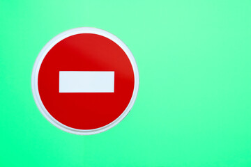Stop road sign on green isolated background