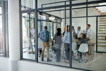 Poster - Getting things going in the boardroom. Full length shot of a business meeting taking place in a glass-walled boardroom.