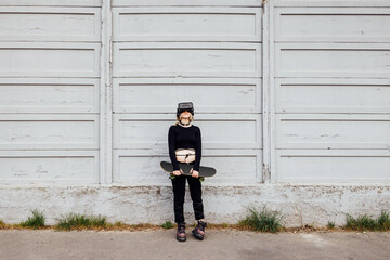 Wall Mural - Diverse young nonconformist woman outdoor posing using 3d goggles