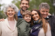 © D M/peopleimages.com - One big happy family. Portrait of a happy multi-generation family standing outdoors.