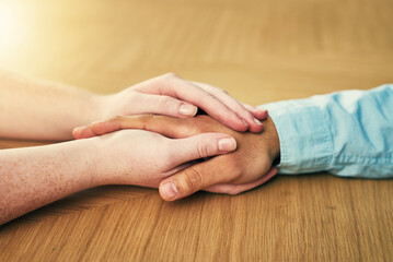 Poster - Help - sometimes we need it, sometimes we give. Cropped shot of a man and woman holding hands in comfort on a table.