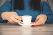 © Alla - woman hand cup of coffee on the desk