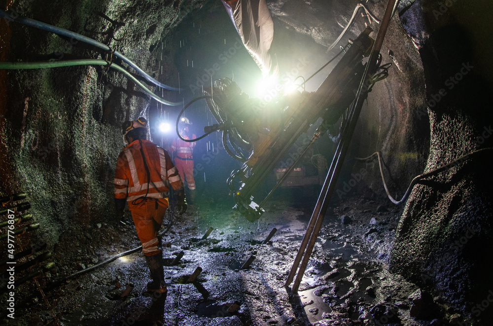 Opermin Mining Mining operator on mining machine, underground mine mesh Stock Photo ...
