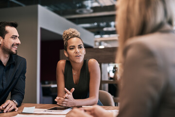Poster - Shes the team manager who knows how to lead. Shot of a group of businesspeople having a meeting in an office.