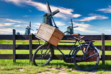 Bicycle With Windmill And Blue Sky Background. Scenic Countryside Landscape Close To Amsterdam In The Netherlands.