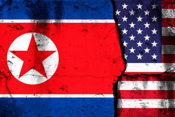 Wall Mural - United States and North Korea crisis. Background with national flags on cracked wall photo